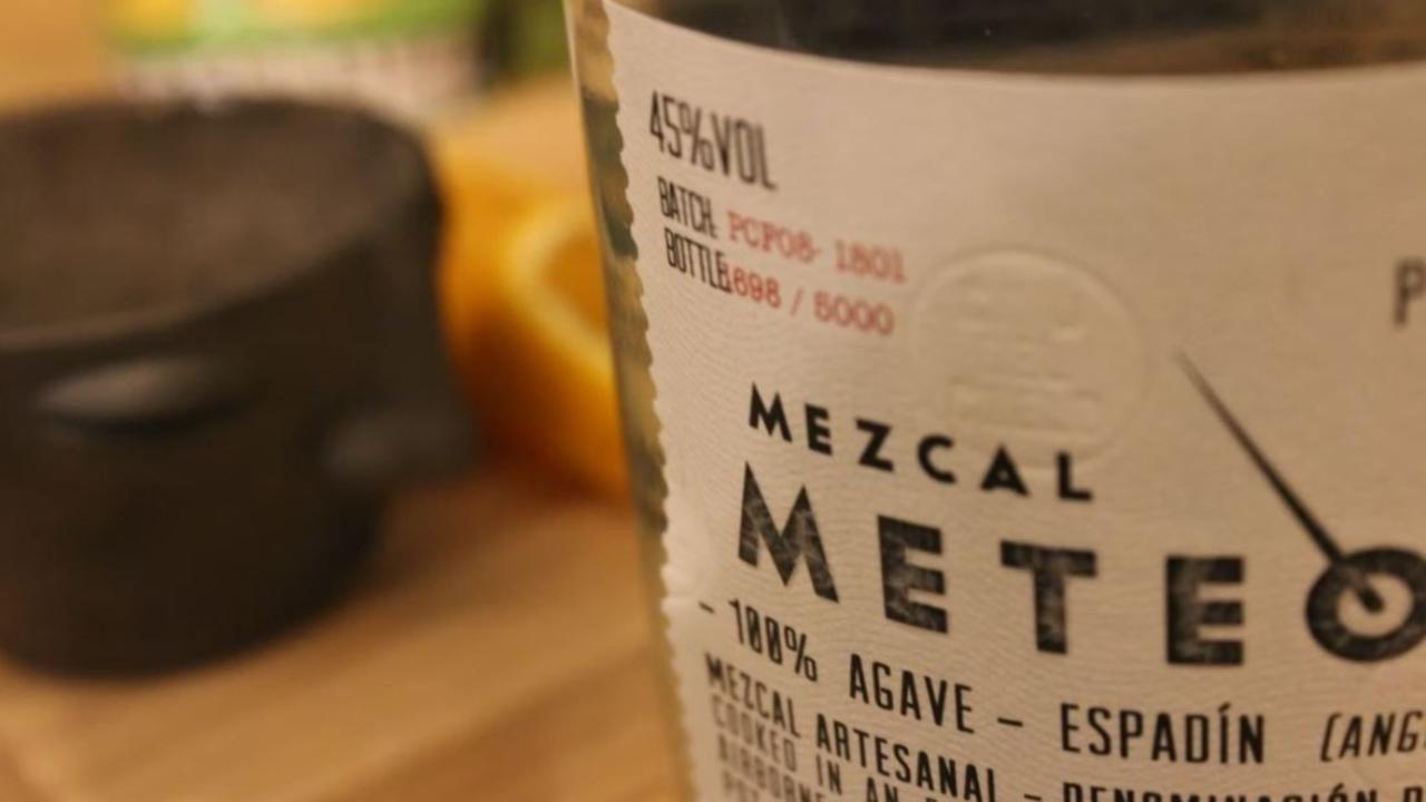 A bottle with a mezcal label 