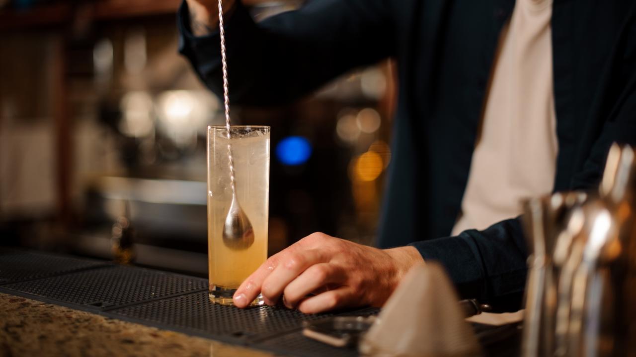 bartender stirring cocktail