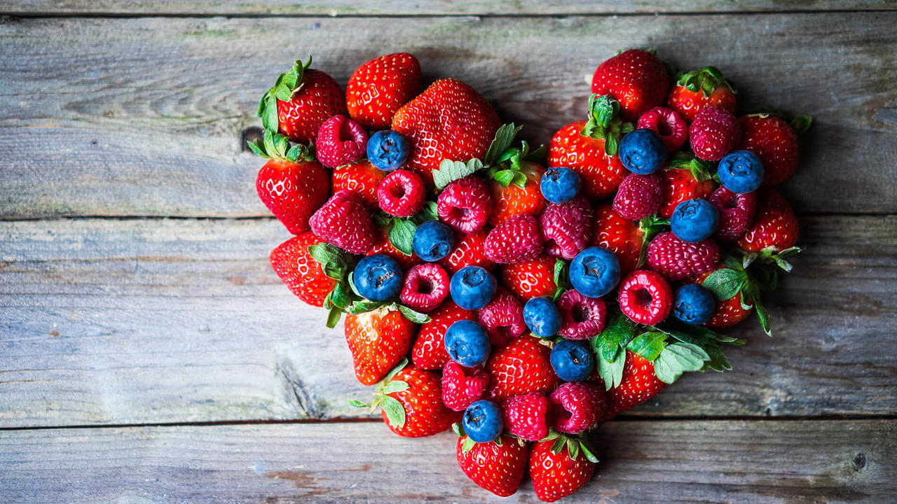 berries heart on wood