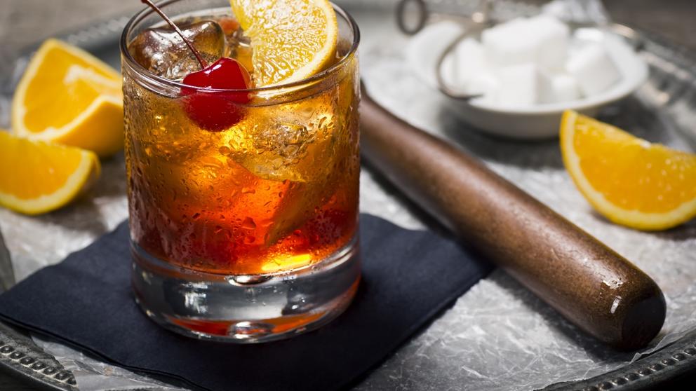 old fashioned cocktail and muddler