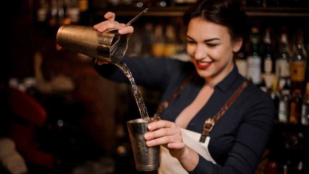 female bartender preparing cocktail