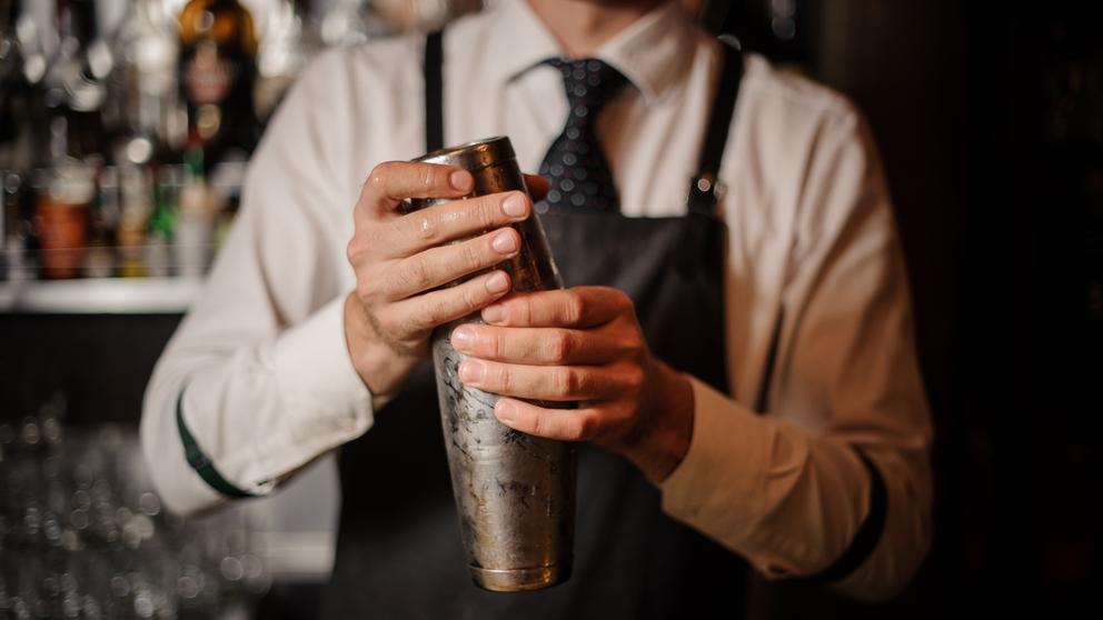 bartender holding boston shaker