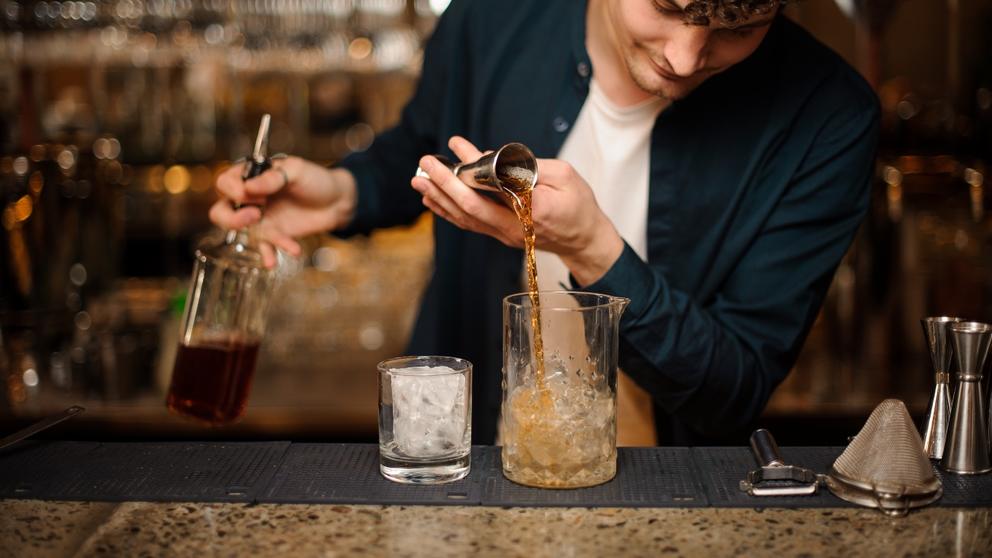 bartender using syrup for cocktail