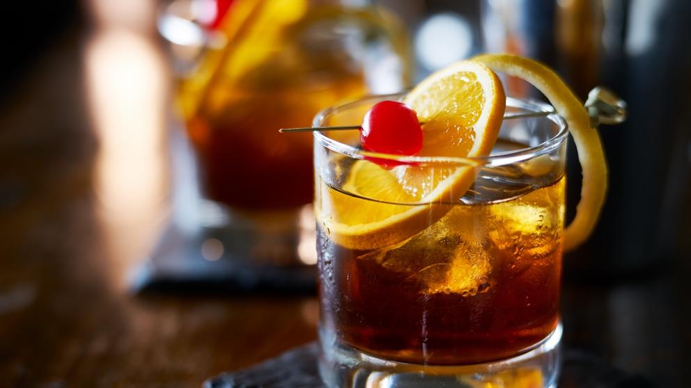 old-fashioned-cocktail-glass-with-orange-and-cherry 